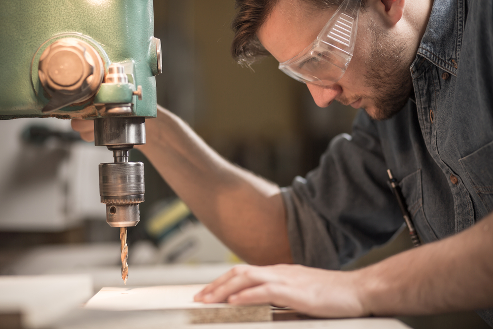 Man Wearing Protective Glasses While Working