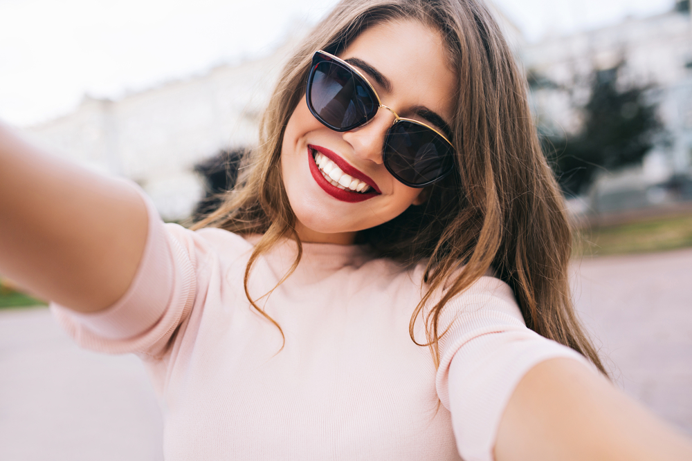 Closeup Selfieportrait of Girl Wearing Sunglasses